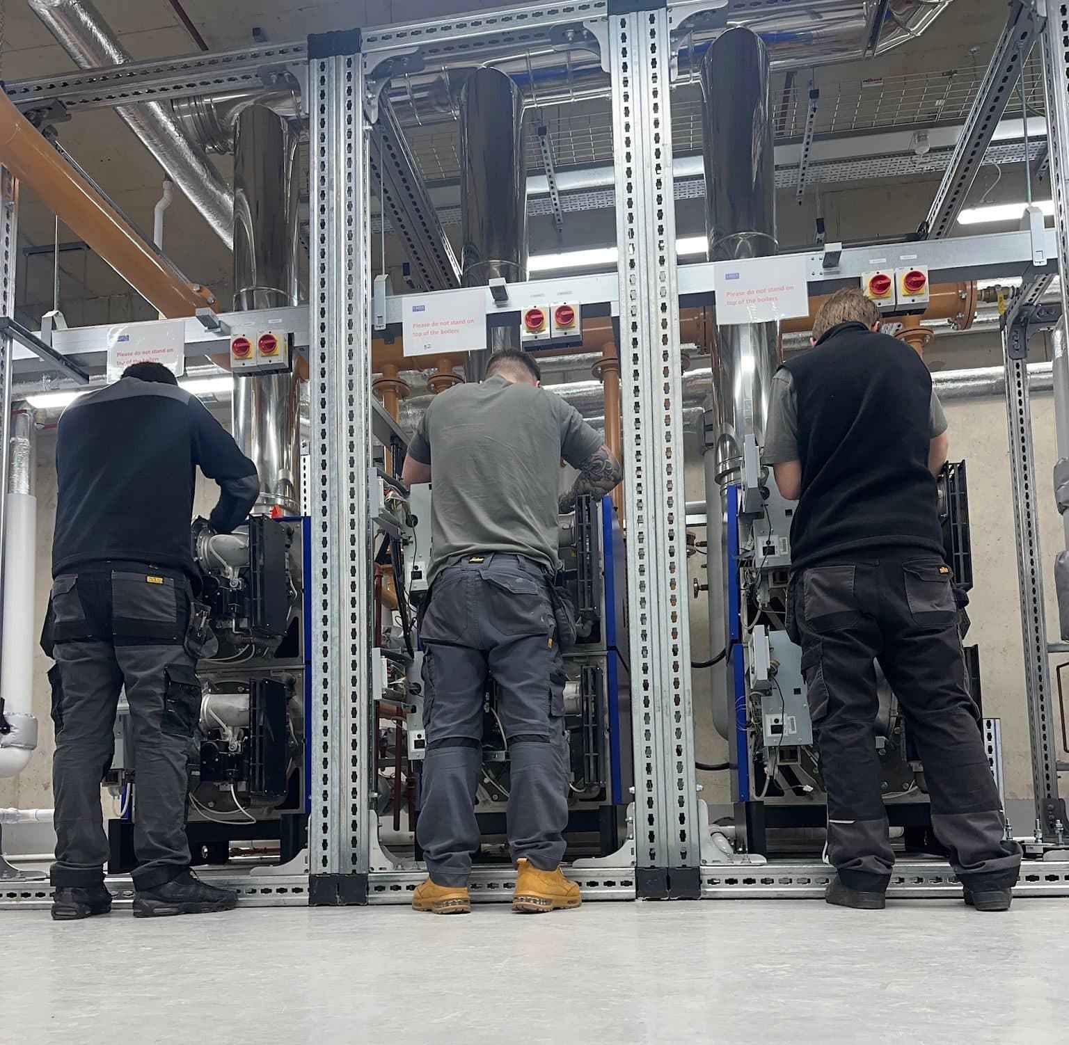 Spitfire Commercial engineers working on framed plant skids
