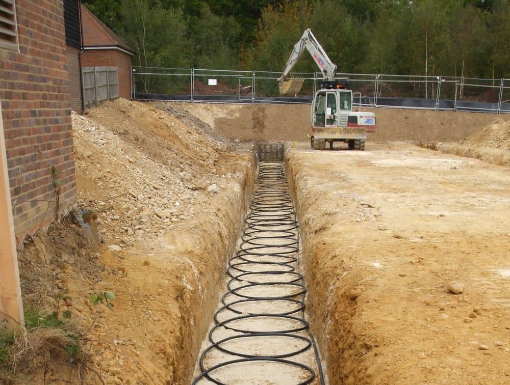 Horizontal slinky ground collectors laid in a trench for a ground source heat pump installation