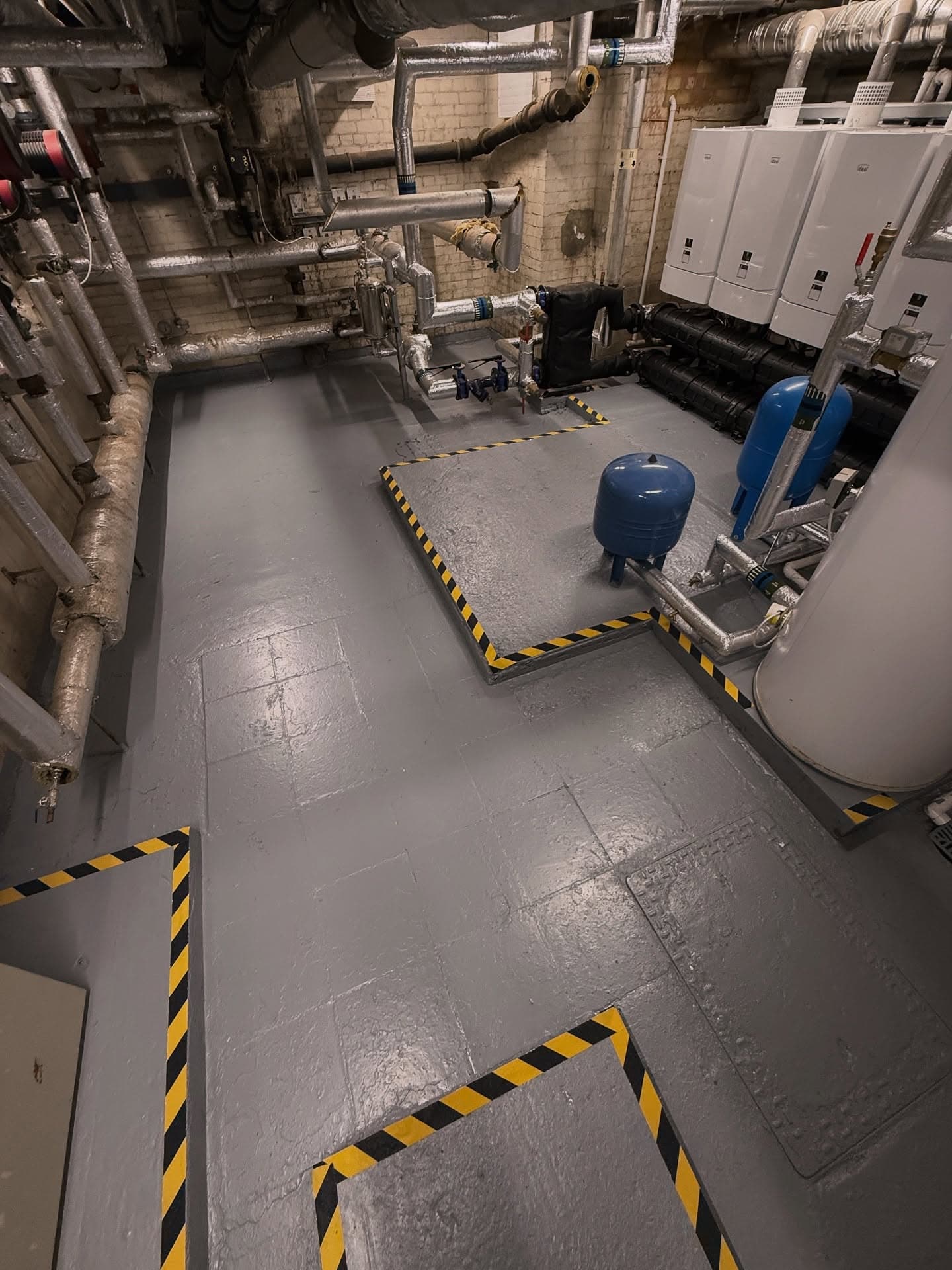 Wide view of a care home plant room installed by Spitfire Commercial
