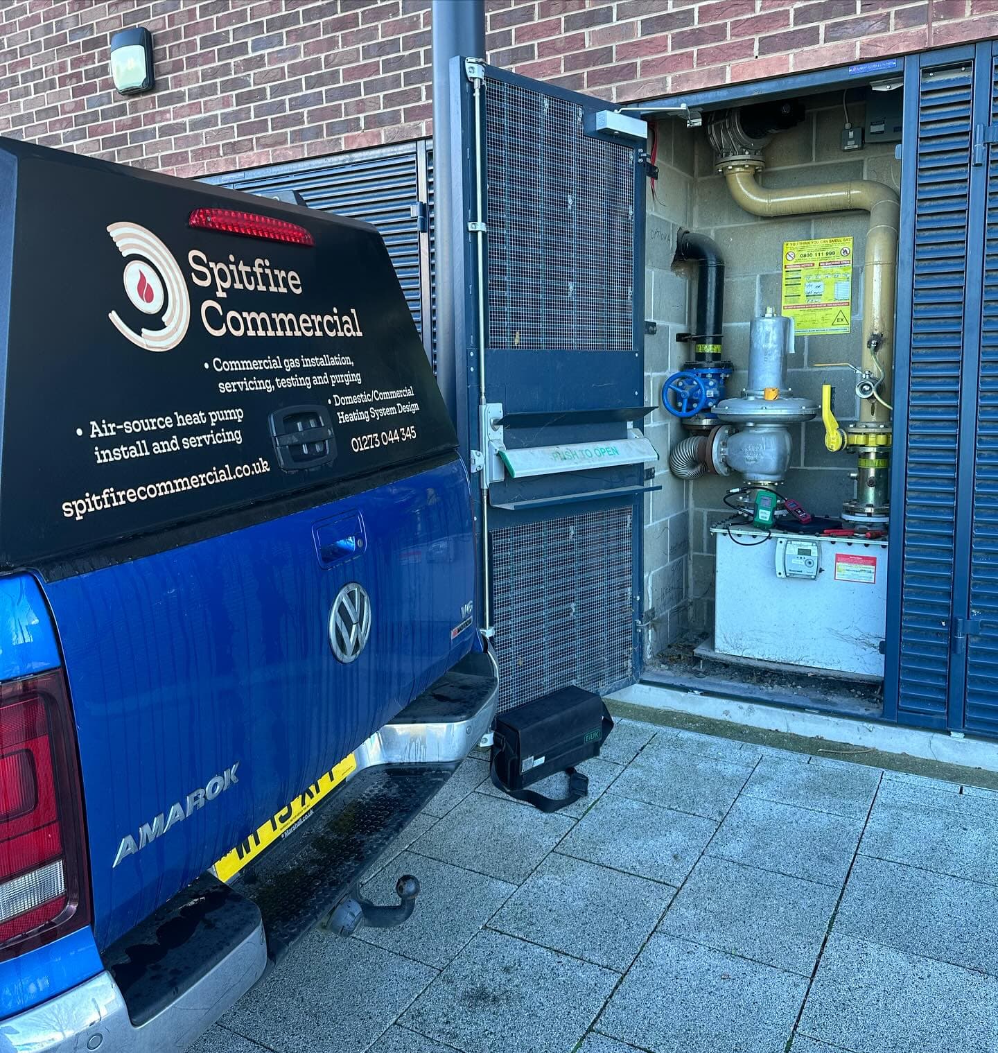 Spitfire Commercial van at a school gas meter cage on a whole-school gas safety check day