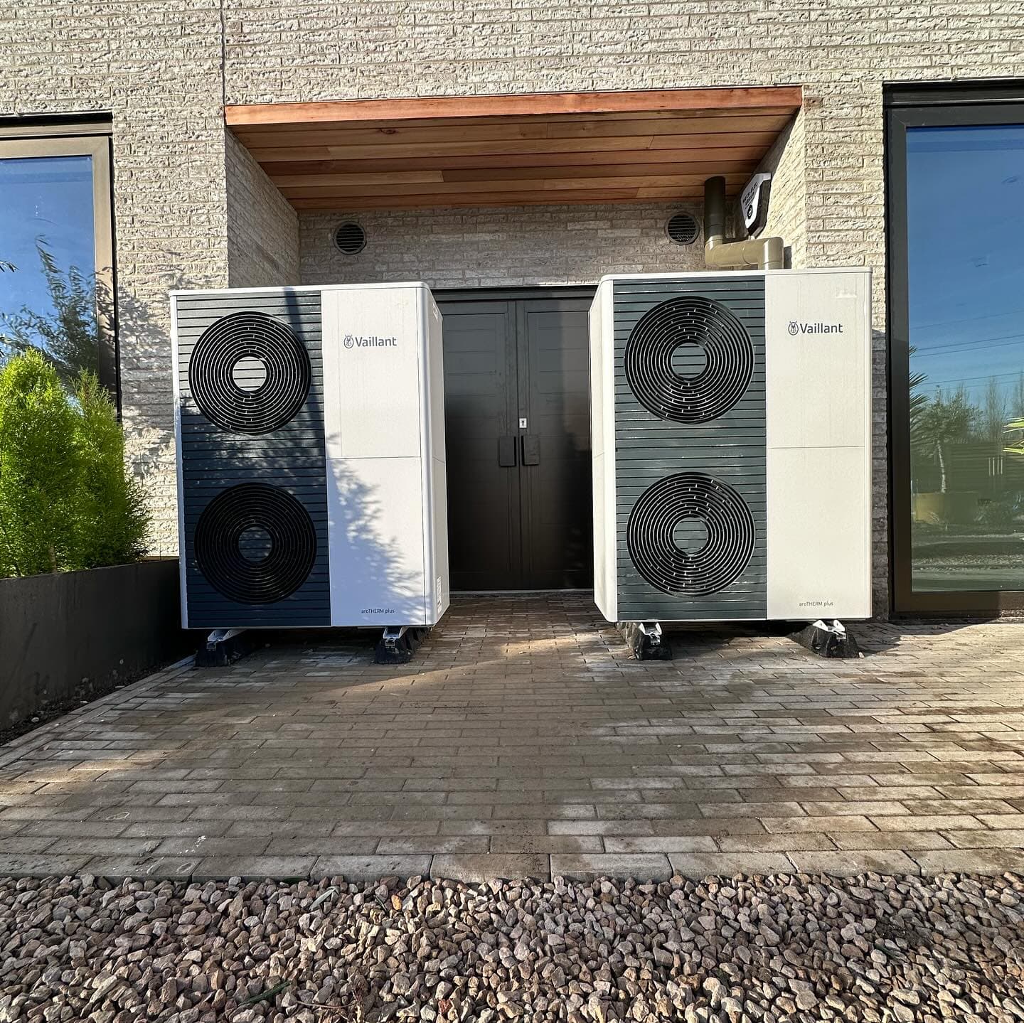 Twin Vaillant heat pumps at the entrance of a completed new-build plot at Twineham Grange