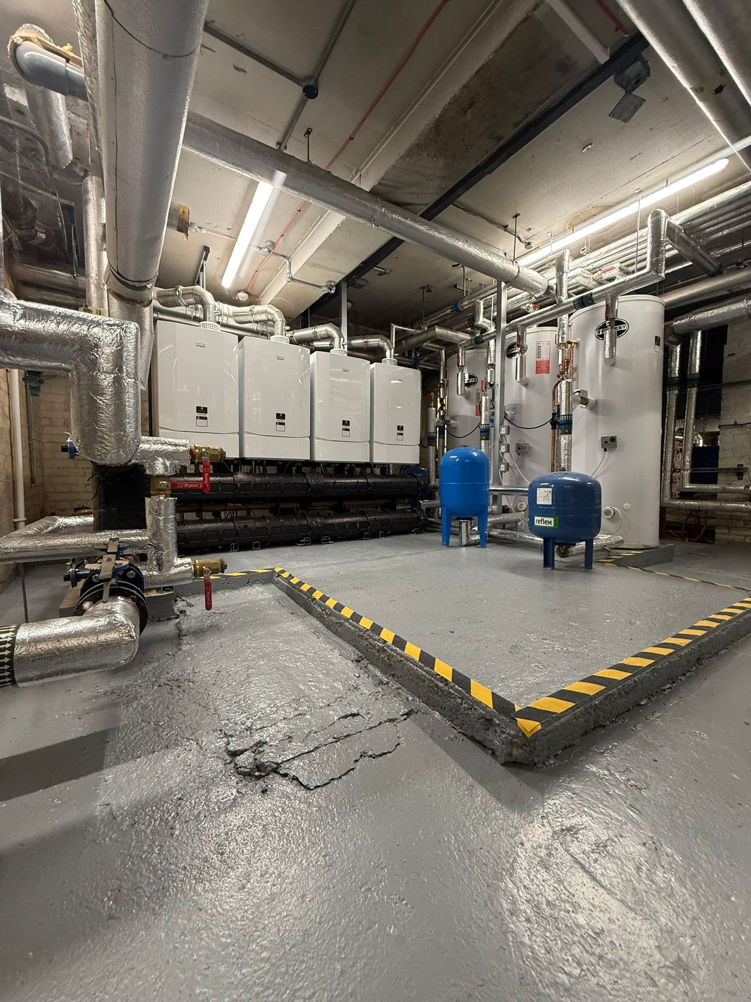 Four-boiler Ideal cascade plant room with twin cylinders installed by Spitfire Commercial